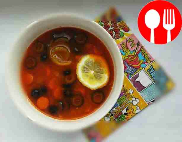 Solyanka with three types of sausage, pork and olives