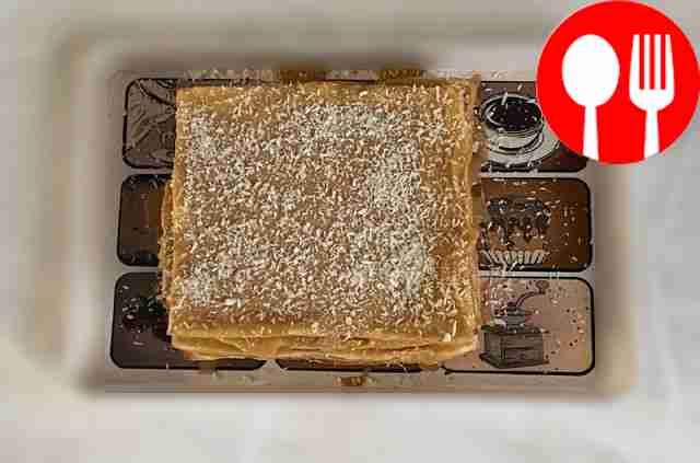 Puff pastry cake with coconut flakes