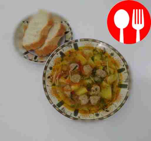 Homemade noodle soup with meatballs