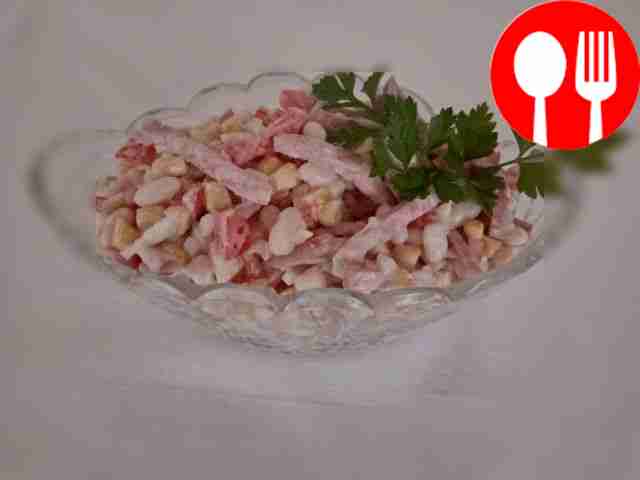 Meat salad with beans, corn and mayonnaise