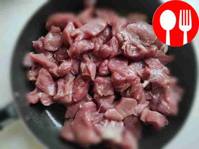 Cut the prepared pork into medium-sized cubes,...