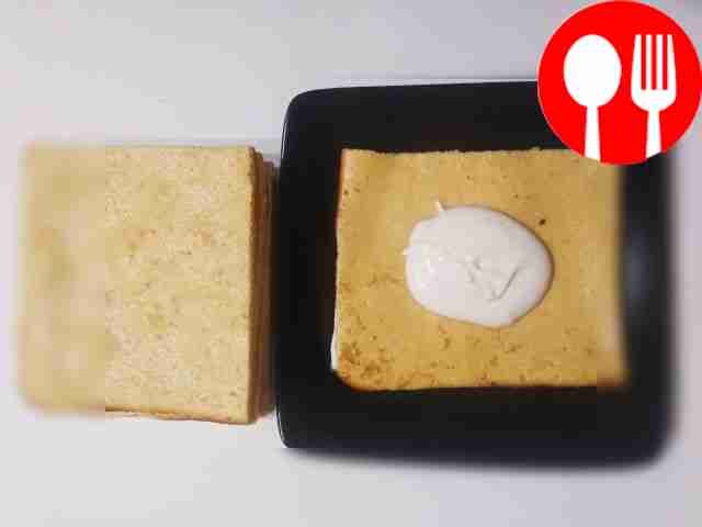 Assemble the cake. Place a little cream on the...