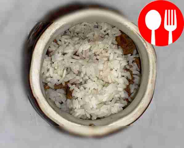 Add pork to a heated frying pan with vegetable...