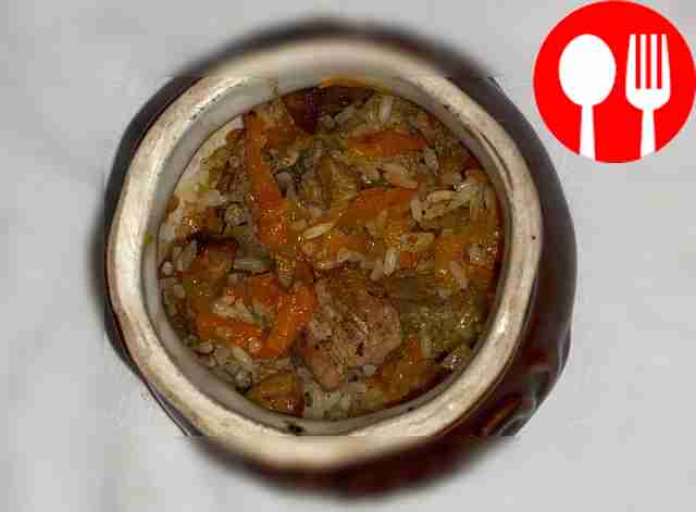 Fragrant pilaf with meat and vegetables in pots