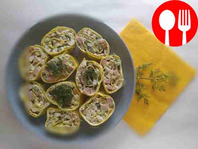 Salad with cucumber, cheese and sausage in a cheese roll