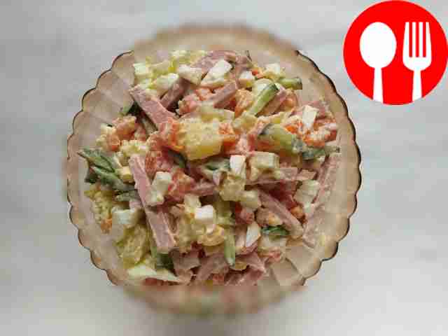 Simple salad with sausage, fresh cucumber and mustard