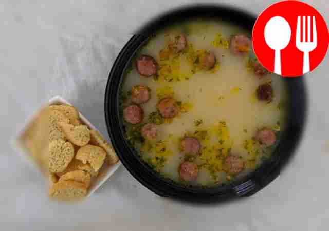 Classic soup with melted cheese and smoked sausages