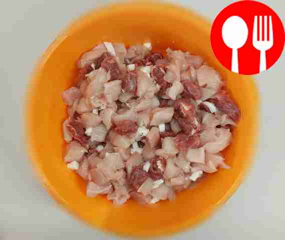 Cut the prepared fillet and lard into small...