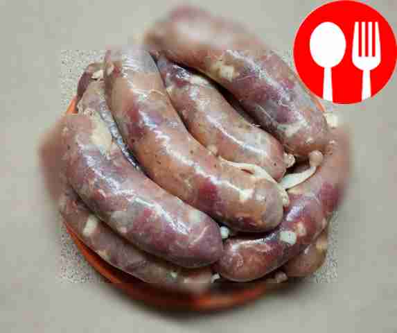 Place the prepared intestines on the sausage...