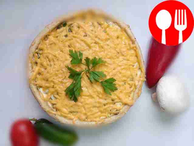 Pie with mushrooms under a cheese cap