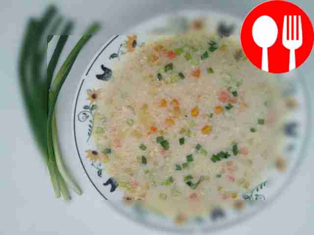Creamy soup with corn and chicken legs
