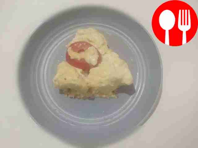 Cauliflower casserole with cheese and tomatoes