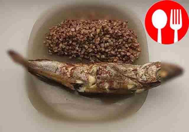 Healthy buckwheat porridge with baked hake