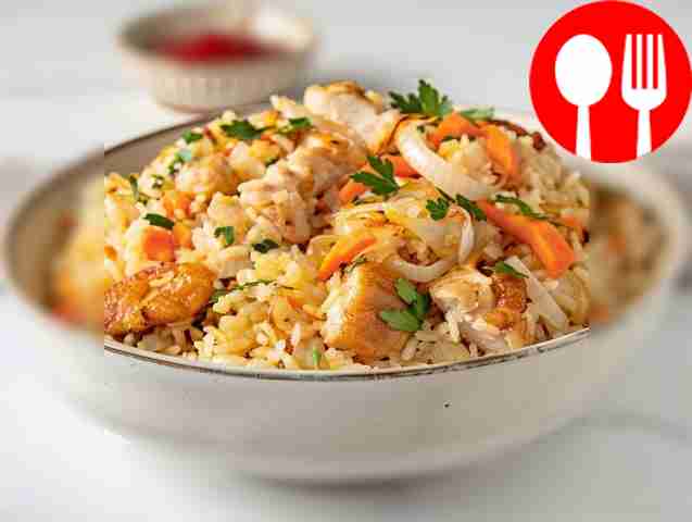 Fragrant pilaf in a roasting pan with chicken