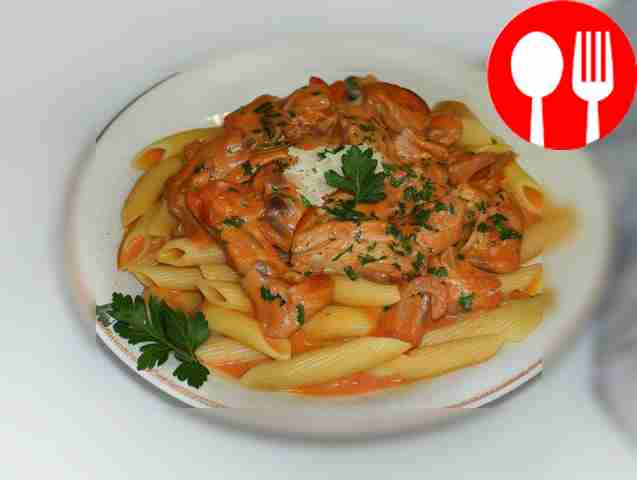 Pork with pasta in spicy tomato sour cream sauce