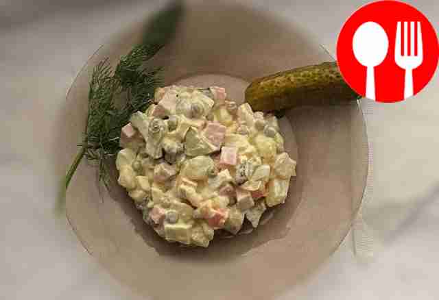Classic Olivier salad with sausage