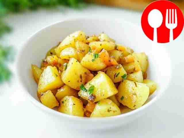 Homemade aromatic stewed potatoes with carrots and onions