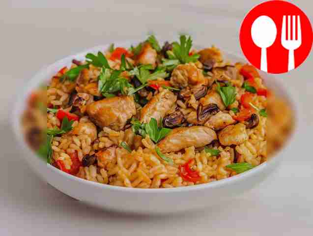 Fragrant rice with chicken, champignons and vegetables
