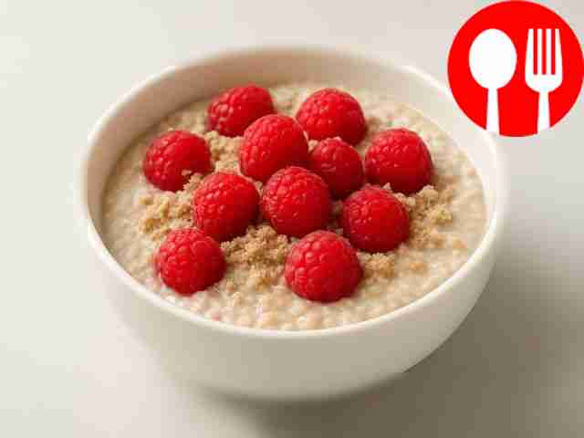 Quick oatmeal with milk, halva and raspberries