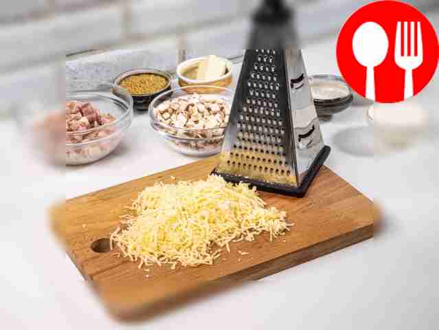Grate the cheese on a fine grater.
