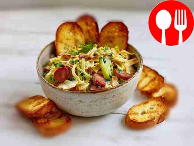 Hearty salad with sausage and pancakes