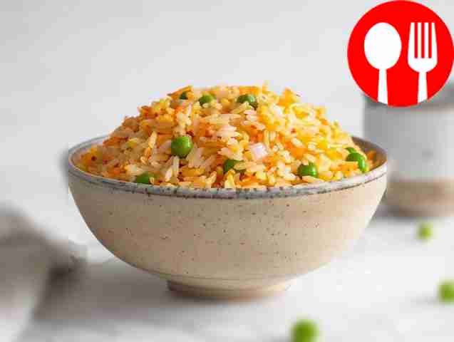Bright side dish of rice with green peas
