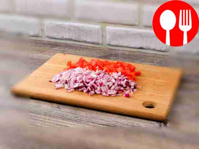 Finely chop the red onion and bell pepper.