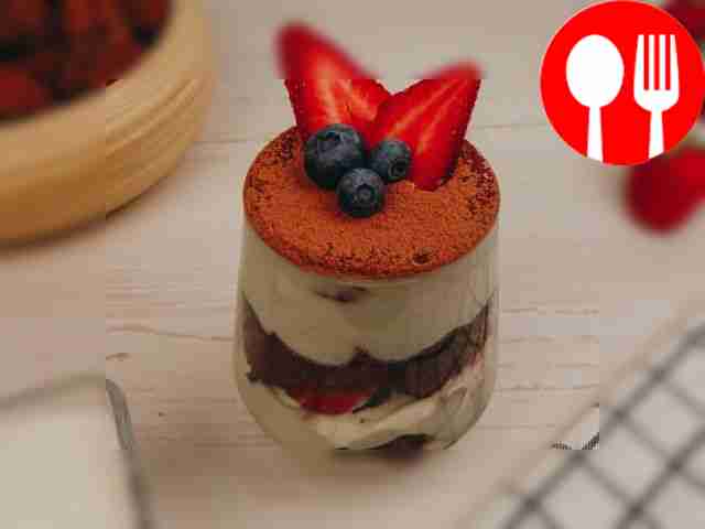 Chocolate sponge cake with curd cream and strawberries