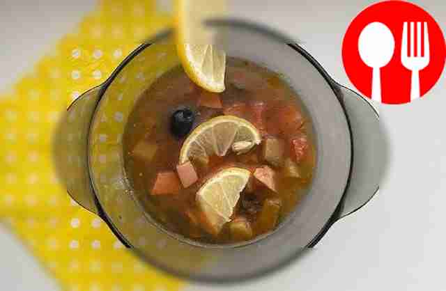 Soup with olives, lemon and sausage