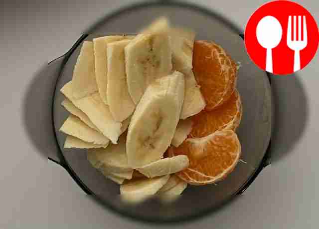 Delicious dessert made from banana, tangerine and yogurt