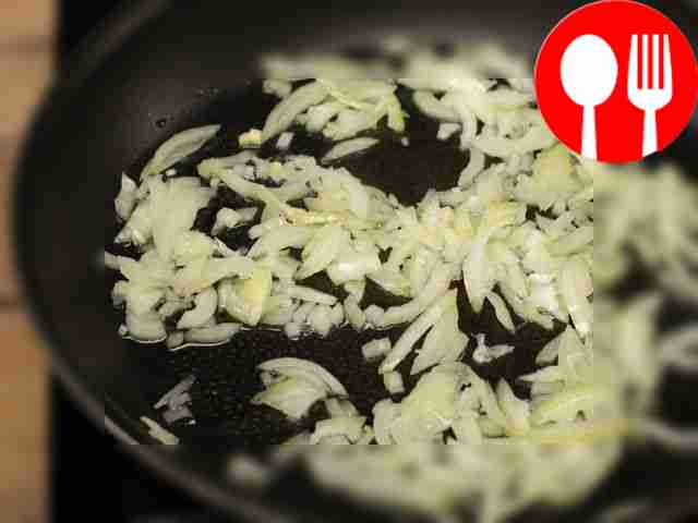 Fry the onion and garlic in heated vegetable...