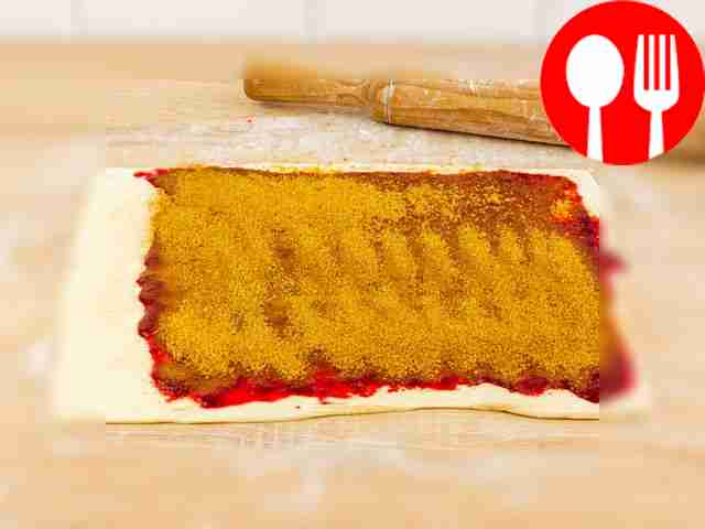 Brush the rolled out dough with cherries and...