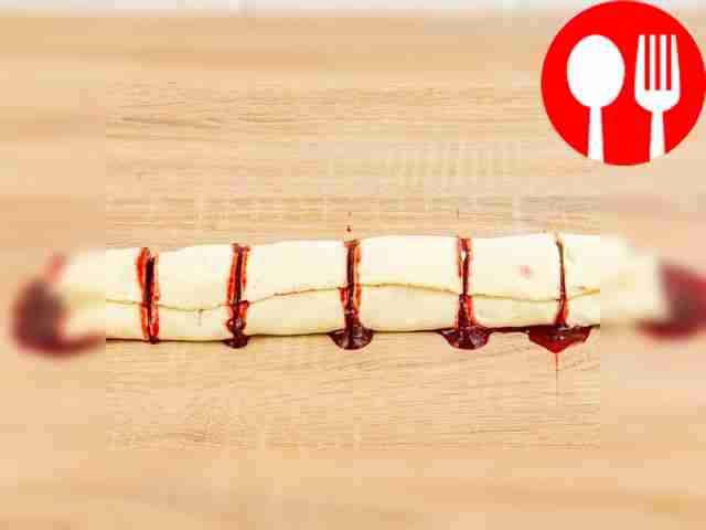 Roll the dough with the filling into a roll...