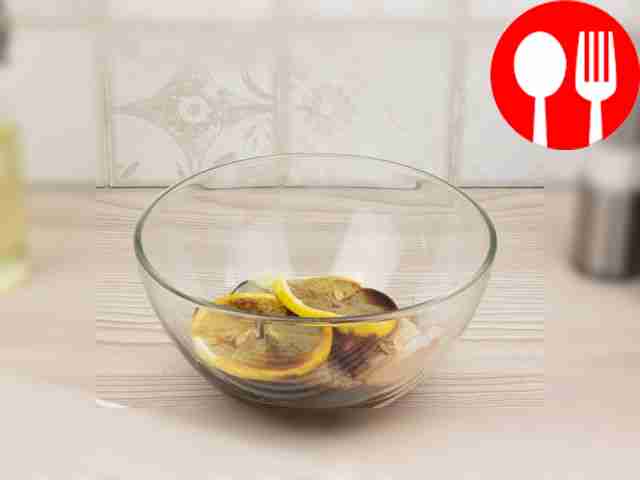 In a deep container, mix soy sauce, lemon,...