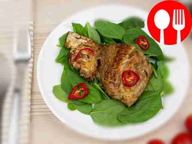 Pike perch with lemon in a frying pan