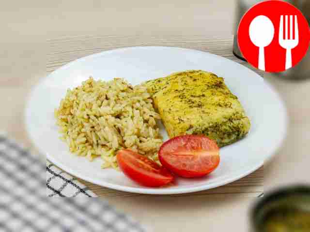 Pike perch with rice in a frying pan