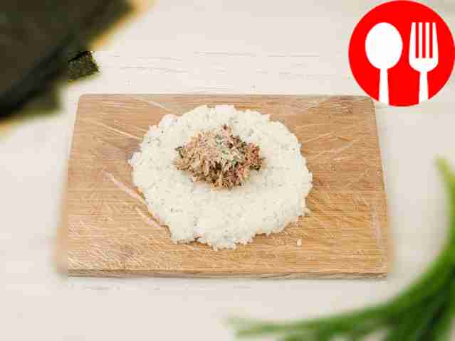 Form the warm rice into a cake and place the...