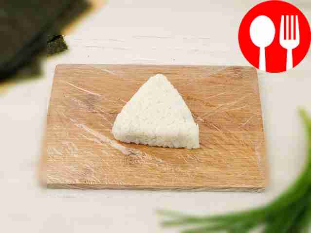 Wrap the filling in rice and form a triangular...