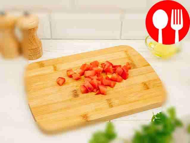 On a clean cutting board, chop the garlic...