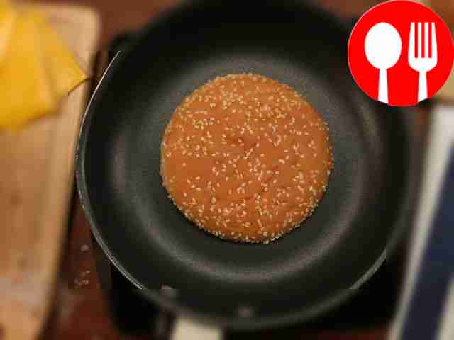 In a dry frying pan, fry the burger bun until...