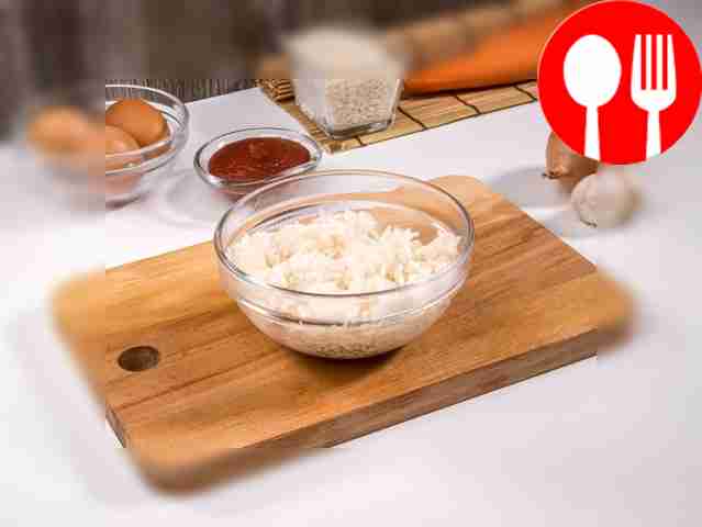 Boil the rice until half cooked in plenty of...