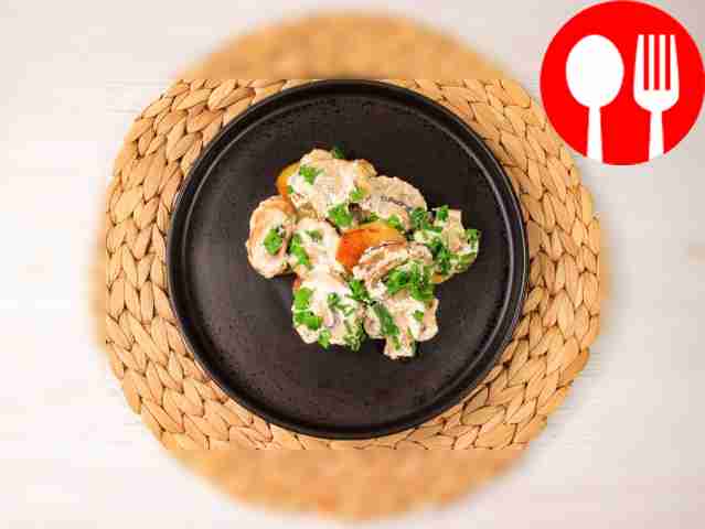 Baked potatoes with champignons in sour cream