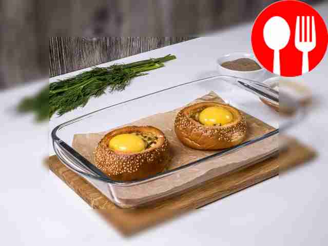 Break an egg into each bun. Salt and pepper to taste.