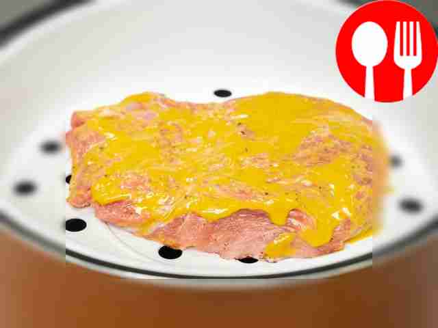 Start cooking the chops. Place the meat on a...