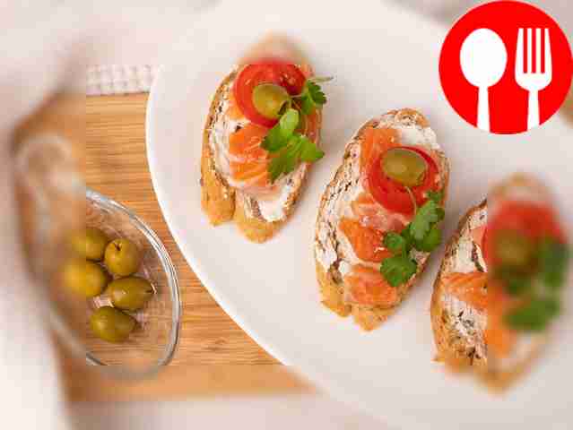 Sandwiches with salmon, olives and tomatoes