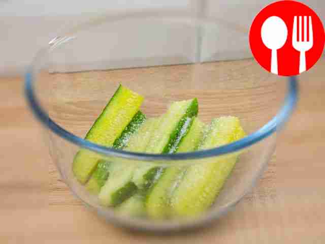 Place the cucumbers in a deep bowl, sprinkle...