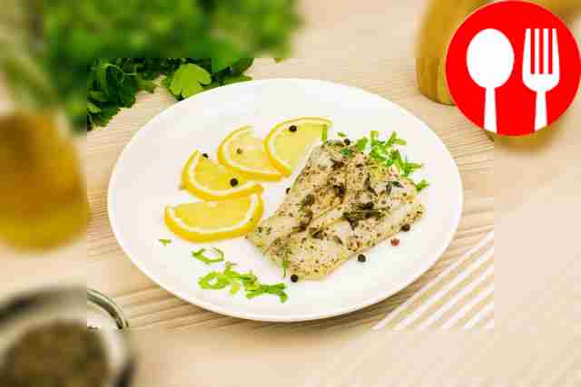 Baked pike perch in wine with aromatic herbs