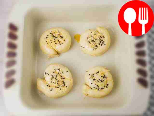 Place the snails on a baking sheet, having...
