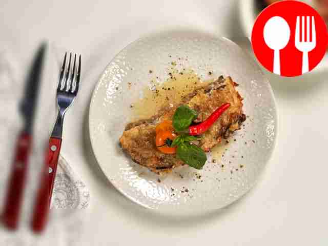 Serve the appetizing moussaka with homemade...