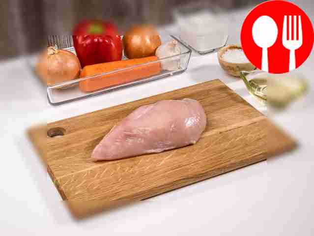 Rinse the chicken fillet and pat dry with a...